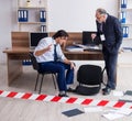 Forensic investigator investigating theft in the office Royalty Free Stock Photo