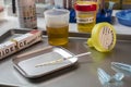 Forensic police analyse several containers of human urine of labelled murder suspects in each Royalty Free Stock Photo