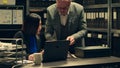 Forensic team examining clues and evidence stored in a case box