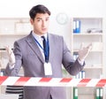 Forensics investigator at the scene of office crime Royalty Free Stock Photo