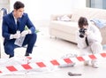 Forensics investigator at the scene of office crime Royalty Free Stock Photo