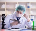 Forensics investigator working in lab on crime evidence Royalty Free Stock Photo