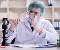 Forensics investigator working in lab on crime evidence Royalty Free Stock Photo