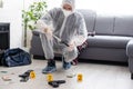 Forensics researcher photographing a blood at a murder scene Royalty Free Stock Photo