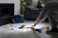 Forensics researcher photographing a blood at a murder scene Royalty Free Stock Photo