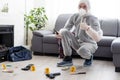 Forensics researcher photographing a blood stained knife at a murder scene Royalty Free Stock Photo