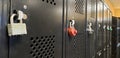 Foreshortened view of black lockers with locks