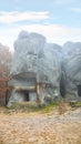 Forest and ancient rocks of Dovbush in Bubnishche in the Carpathian mountains. Foggy wheather Royalty Free Stock Photo