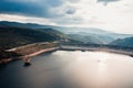 Forest in Autumn with trees near a lake in the mountains aerial view Royalty Free Stock Photo