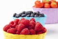 Forest berries, raspberries, blueberries and strawberries in baskets Royalty Free Stock Photo