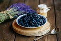 Forest blueberries on a wood table. Fragrant Lavender and Honey with Flowers wood background Royalty Free Stock Photo