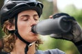 Forest, cyclist and man drinking water, fitness and wellness with hydration, exercise and workout. Healthy person