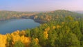 Forest in the fall lake in autumn view from the sky. Lake reflections of fall foliage. Aerial Colorful autumn foliage Royalty Free Stock Photo