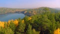 Forest in the fall lake in autumn view from the sky. Lake reflections of fall foliage. Aerial Colorful autumn foliage Royalty Free Stock Photo