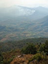 Forest Fire Burning in Loei Province the high land forest. Amongst the forested hills some local people continue to live self