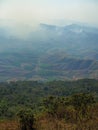 Forest Fire Burning in Loei Province the high land forest. Amongst the forested hills some local people continue to live self