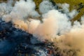 Forest fire in dry season. Smoke from burning grass and trees, aerial top view