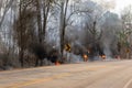 Forest fire near the edge of the highway in Thailand