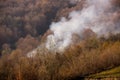 Forest fire smoke on the slopes hills Royalty Free Stock Photo