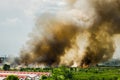 Forest fires in the city on a hot oversupply. Firefighter helped hasten to prevent fire spread to the village.