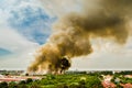 Forest fires in the city on a hot oversupply. Firefighter helped hasten to prevent fire spread to the village. Royalty Free Stock Photo