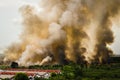 Forest fires in the city on a hot oversupply. Firefighter helped hasten to prevent fire spread to the village. Royalty Free Stock Photo