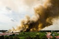 Forest fires in the city on a hot oversupply. Firefighter helped hasten to prevent fire spread to the village. Royalty Free Stock Photo