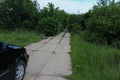 The forest hides a concrete road for tanks. The largest secret facility anti-nuclear bunker 1180. Moldova Oliscani Royalty Free Stock Photo