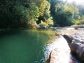 Forest green lake with trees and rocks. Mediterranean landscape Royalty Free Stock Photo