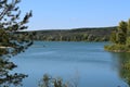 Forest lake in the autumn afternoon. Calm water with reflection of trees Royalty Free Stock Photo