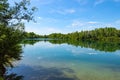 Forest lake in German national park with clear blue sky reflection