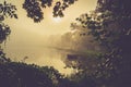 Forest and lake, misty morning