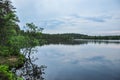 Forest lake in nasty cloudy summer day