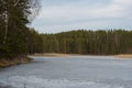 Forest lake under melting spring ice. Royalty Free Stock Photo