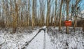 Forest landscape in winter - snow on the ground, car tracks in snow - interdiction sign Royalty Free Stock Photo