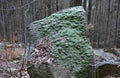 Forest mining of granite stone directly in the forest on solitary boulder. In the past, the easiest way to get a stone. to this da