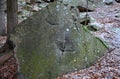 Forest mining of granite stone directly in the forest on solitary boulder. In the past, the easiest way to get a stone. to this da