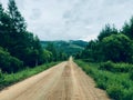 Forest mist fog on the mountain with  muddy road downhill Royalty Free Stock Photo