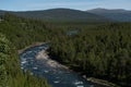 Forest mountain landscape with a river in Norway, close to the village Beitostolen