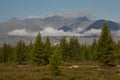 Forest mountains in the background.