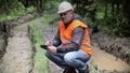 Forest officer on rutted forest road