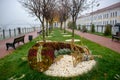 Forest park and dry rivulet bed with fallen leaves in misty autumn. Russia Rybinsk Royalty Free Stock Photo