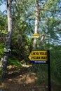 Forest path with a trail sign on a Lycian way between Butterfly valley beach and Kabak beach, near Fethiye