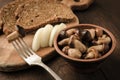 Forest pickled mushrooms on a rustic table Royalty Free Stock Photo