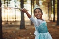 Forest, princess costume and girl with stick for playing fantasy, childhood games and happiness. Nature, fairy tale and