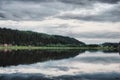 Reflection of the forest on the quiet surface of the lake Royalty Free Stock Photo