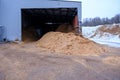 Forest residues mulched as wood chips used for heating. A pile of wood chips for a biomass boiler. For heating small