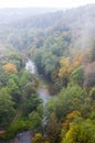 Forest river landscape draped in fog at autumn Royalty Free Stock Photo