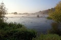 Forest River rapids morning fog at sunrise Royalty Free Stock Photo