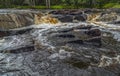 On a forest river, a small rocky threshold blocked the channel